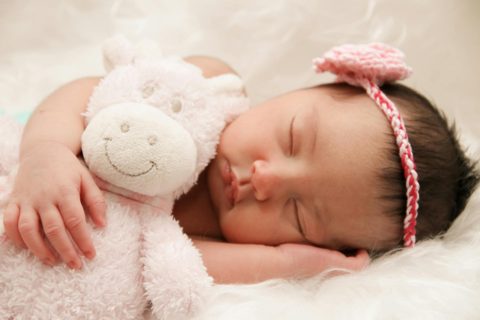 Mother holding newborn during a People Studio session