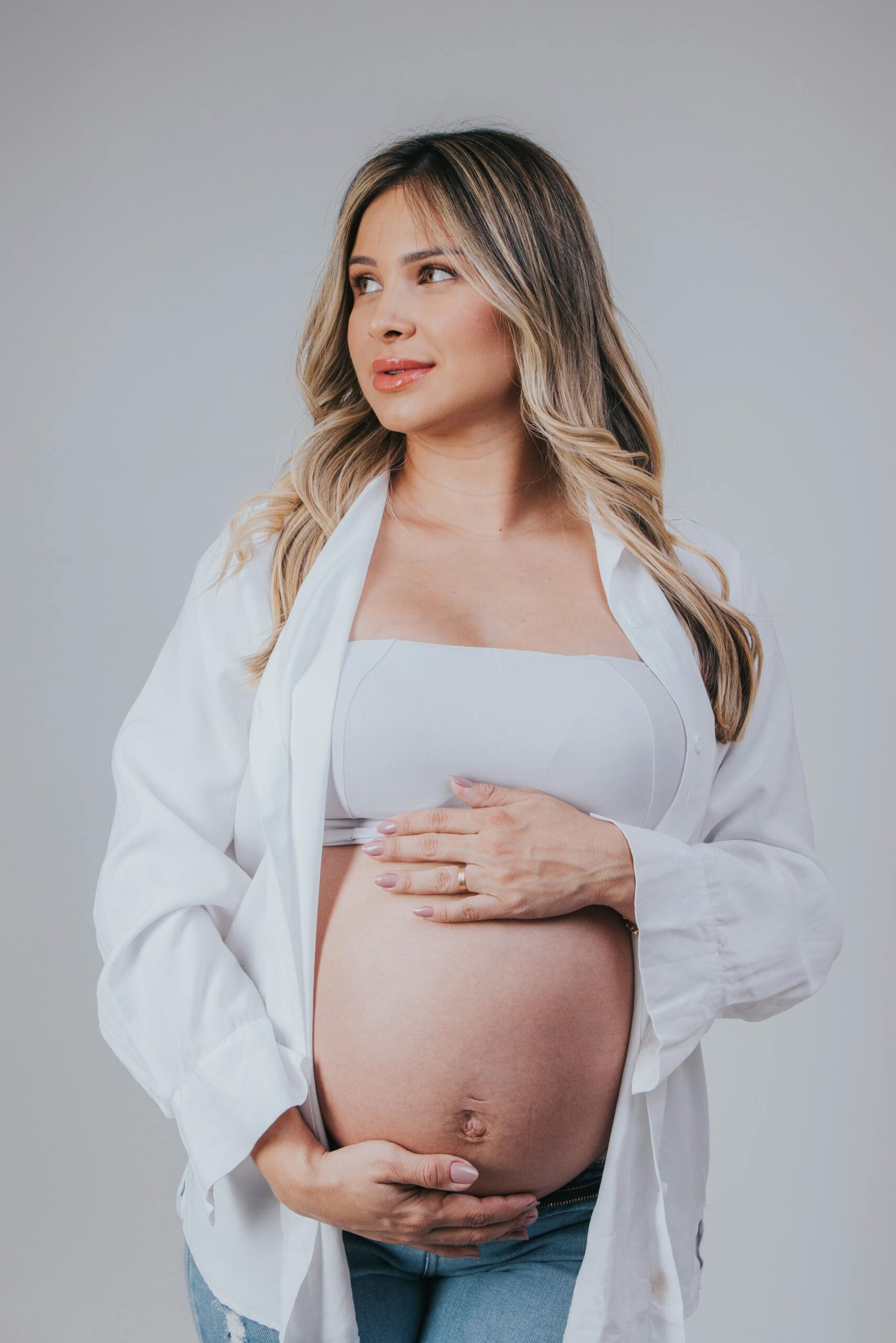 Mother in flowing dress during maternity photography session